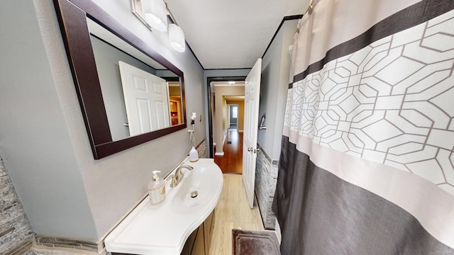 174 Round Hill Rd, Meriden, CT 06450 - bathroom with wood finished floors, vanity, and a shower with curtain