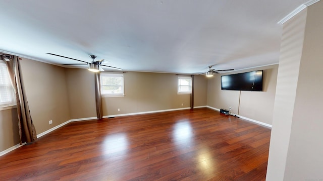 174 Round Hill Rd, Meriden, CT 06450 - unfurnished living room featuring ceiling fan, healthy amount of natural light, wood finished floors, baseboards, and crown molding