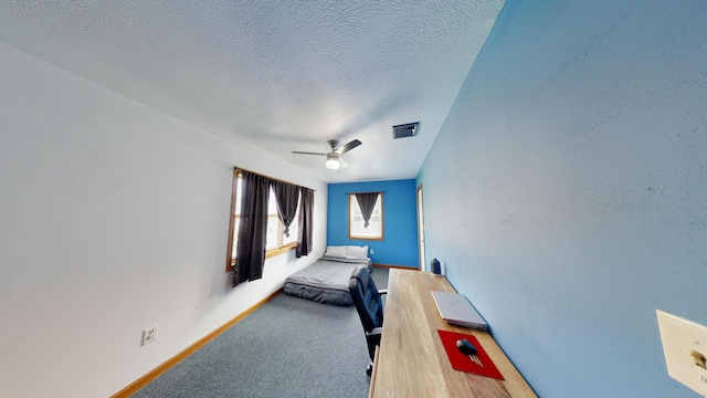 174 Round Hill Rd, Meriden, CT 06450 - bedroom featuring a textured ceiling, baseboards, ceiling fan, and carpet