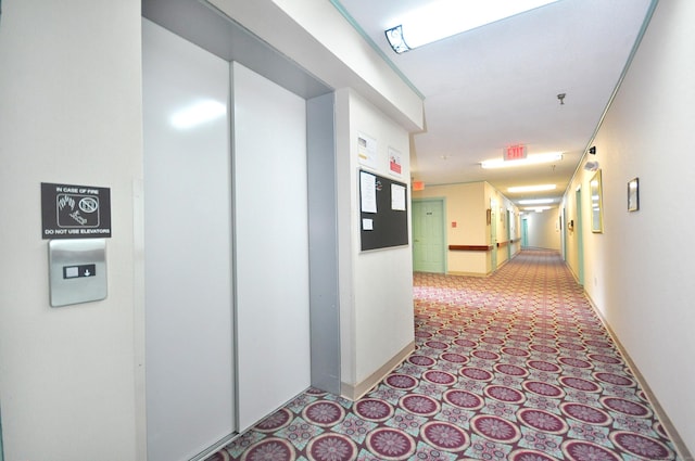 625 Palisado Ave Apt 206, Windsor, CT 06095 - hallway featuring elevator and baseboards