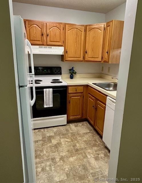 625 Palisado Ave Apt 206, Windsor, CT 06095 - kitchen featuring ventilation hood, white appliances, a sink, light countertops, and a textured ceiling