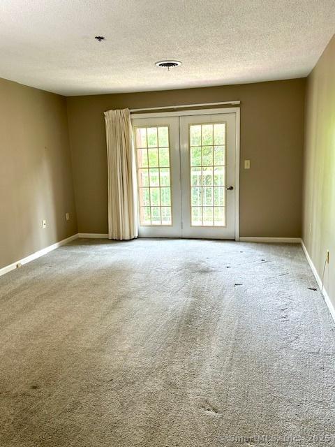 625 Palisado Ave Apt 206, Windsor, CT 06095 - carpeted spare room featuring a textured ceiling and baseboards