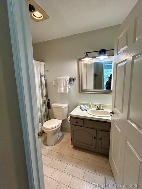 625 Palisado Ave Apt 206, Windsor, CT 06095 - full bathroom with tile patterned flooring, vanity, and toilet