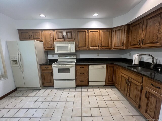 27 Rolling Ridge Rd Unit 27, Monroe, CT 06468 - kitchen featuring white appliances, dark countertops, brown cabinetry, and recessed lighting