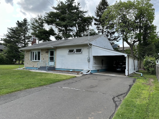 130 Judd Ave, New Britain, CT 06051 - view of front of property with driveway, a front yard, a chimney, and a carport