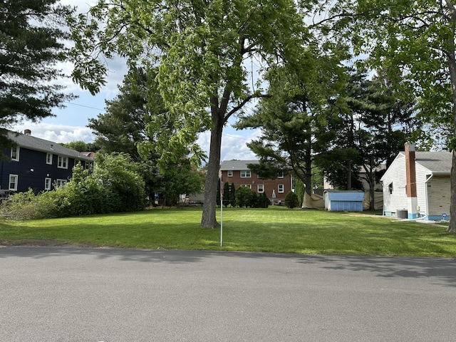 130 Judd Ave, New Britain, CT 06051 - view of front of property featuring a front lawn and central AC