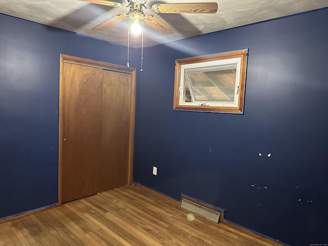 130 Judd Ave, New Britain, CT 06051 - unfurnished bedroom featuring hardwood / wood-style floors, a closet, and ceiling fan