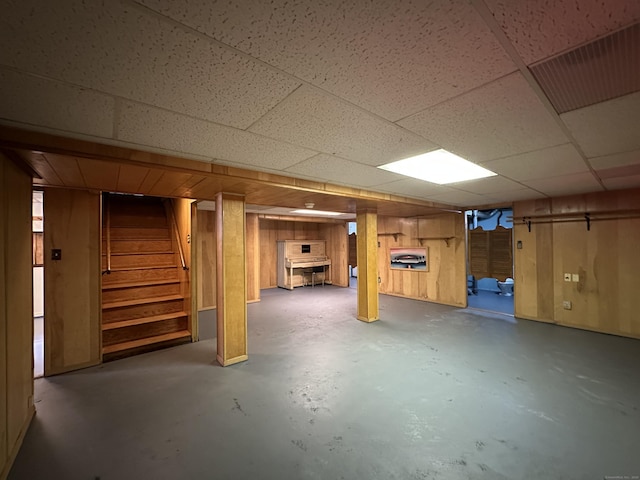 130 Judd Ave, New Britain, CT 06051 - finished below grade area with stairway, a paneled ceiling, and wooden walls