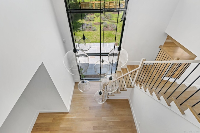 52 Garibaldi Ln, New Canaan, CT 06840 - staircase with baseboards, plenty of natural light, and wood finished floors