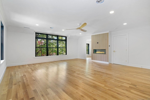 52 Garibaldi Ln, New Canaan, CT 06840 - unfurnished living room featuring light wood finished floors, crown molding, baseboards, a ceiling fan, and recessed lighting
