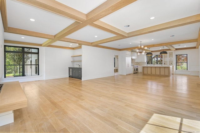 52 Garibaldi Ln, New Canaan, CT 06840 - unfurnished living room featuring a chandelier, beam ceiling, light wood-style flooring, coffered ceiling, and baseboards