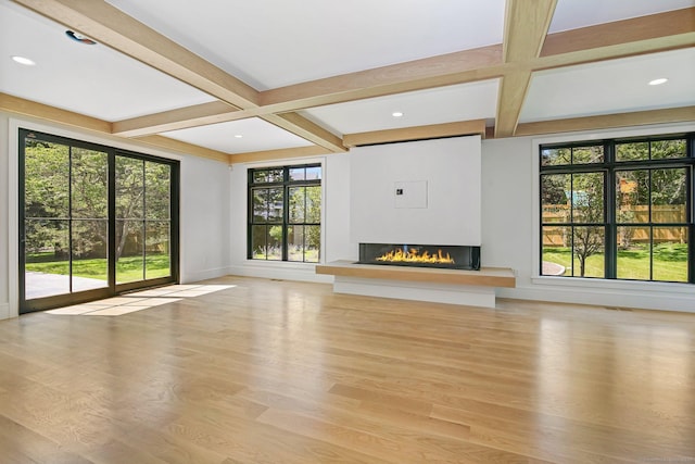 52 Garibaldi Ln, New Canaan, CT 06840 - unfurnished living room featuring coffered ceiling, a glass covered fireplace, beamed ceiling, wood finished floors, and baseboards
