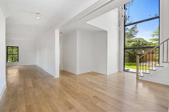 52 Garibaldi Ln, New Canaan, CT 06840 - empty room featuring stairway, wood finished floors, and baseboards