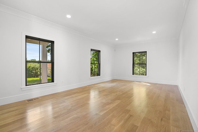 52 Garibaldi Ln, New Canaan, CT 06840 - spare room with ornamental molding, light wood-style flooring, baseboards, and recessed lighting