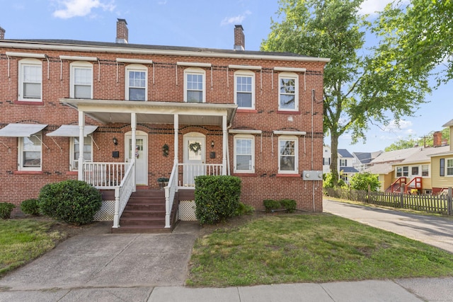 28 Chestnut St, Windsor Locks, CT 06096 - townhome / multi-family property with brick siding, a chimney, and a porch