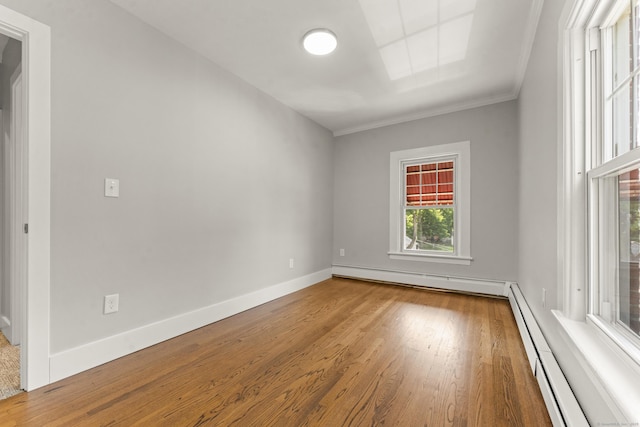 28 Chestnut St, Windsor Locks, CT 06096 - unfurnished room with baseboard heating, wood finished floors, crown molding, and baseboards
