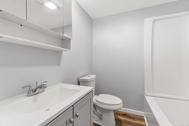 226 Quinn St, Naugatuck, CT 06770 - full bath featuring vanity, toilet, wood finished floors, a bathtub, and baseboards