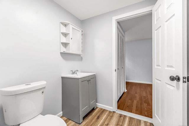 226 Quinn St, Naugatuck, CT 06770 - bathroom with vanity, wood finished floors, baseboards, and toilet