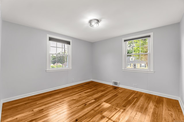 226 Quinn St, Naugatuck, CT 06770 - unfurnished room with light wood-style floors, healthy amount of natural light, and baseboards