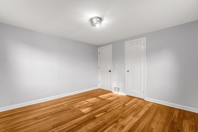 226 Quinn St, Naugatuck, CT 06770 - unfurnished bedroom featuring baseboards, light wood-style flooring, and a closet