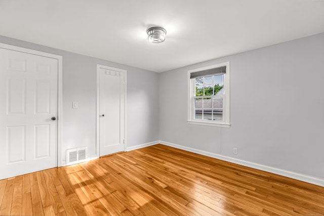 226 Quinn St, Naugatuck, CT 06770 - unfurnished bedroom with light wood-style floors, baseboards, and a closet