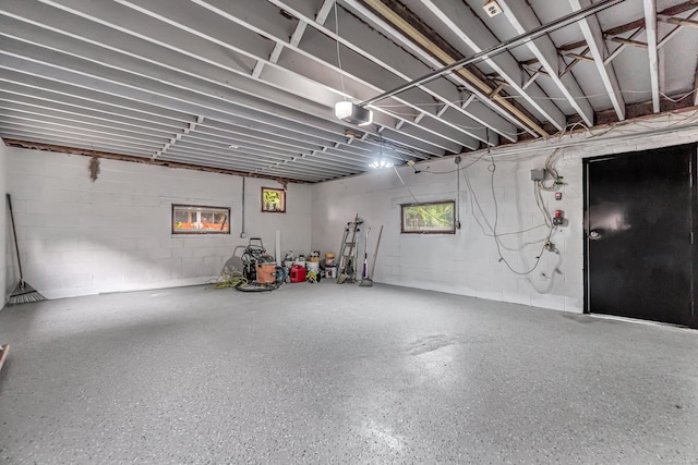 226 Quinn St, Naugatuck, CT 06770 - garage with concrete block wall and a garage door opener