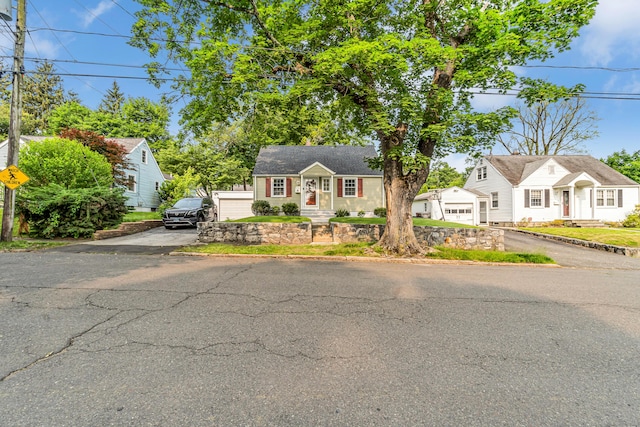 226 Quinn St, Naugatuck, CT 06770 - view of front facade featuring a garage and driveway