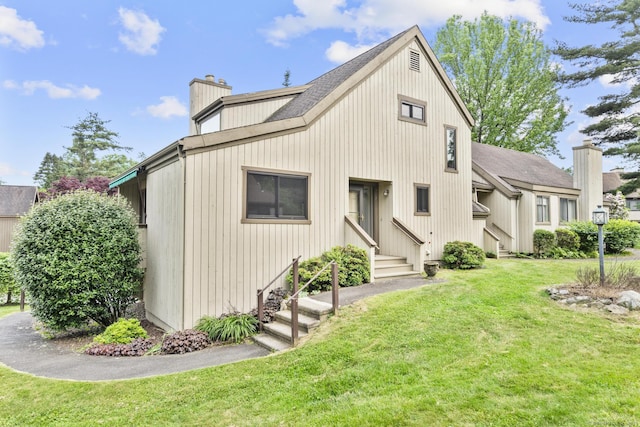 513 Opa Ln Unit B, Stratford, CT 06614 - view of front of property with entry steps, a chimney, and a front lawn