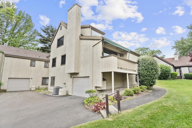 513 Opa Ln Unit B, Stratford, CT 06614 - view of property with central AC, an attached garage, and driveway
