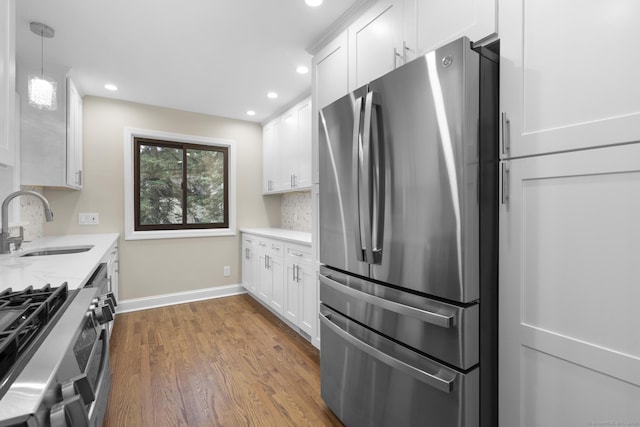 513 Opa Ln Unit B, Stratford, CT 06614 - kitchen featuring stainless steel appliances, a sink, white cabinetry, recessed lighting, and dark wood-style floors