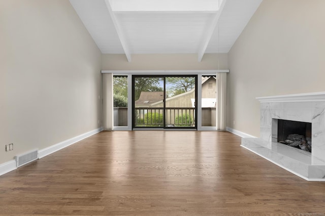513 Opa Ln Unit B, Stratford, CT 06614 - unfurnished living room featuring wood finished floors, a fireplace, and baseboards