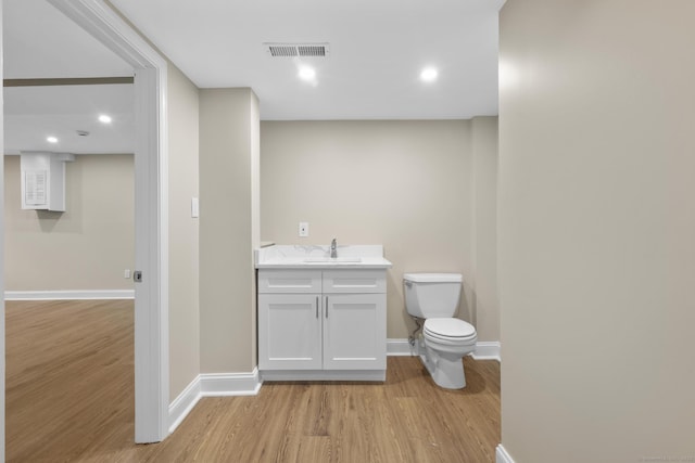 513 Opa Ln Unit B, Stratford, CT 06614 - bathroom featuring toilet, wood finished floors, baseboards, and vanity
