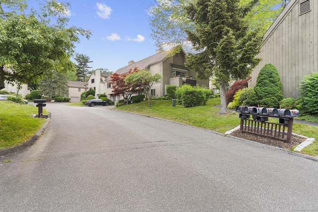 513 Opa Ln Unit B, Stratford, CT 06614 - view of asphalt road with curbs and a residential view
