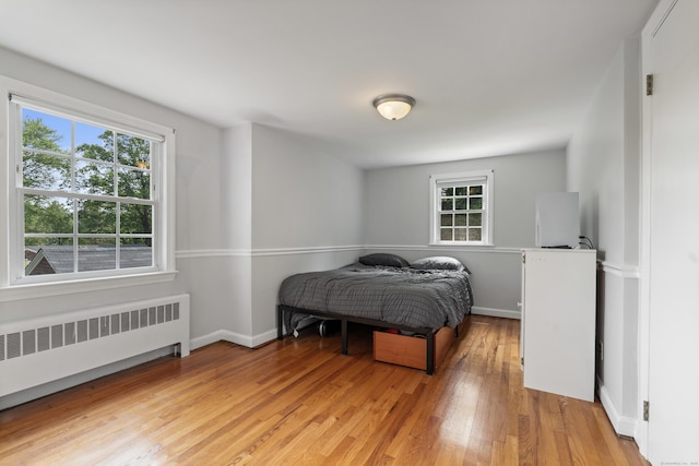 43 Superior Ave, Newington, CT 06111 - bedroom with radiator, light wood-style floors, and baseboards