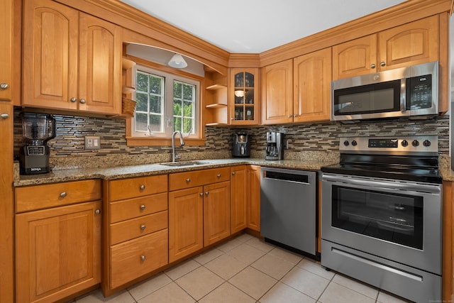 43 Superior Ave, Newington, CT 06111 - kitchen featuring stainless steel appliances, a sink, stone countertops, light tile patterned floors, and decorative backsplash