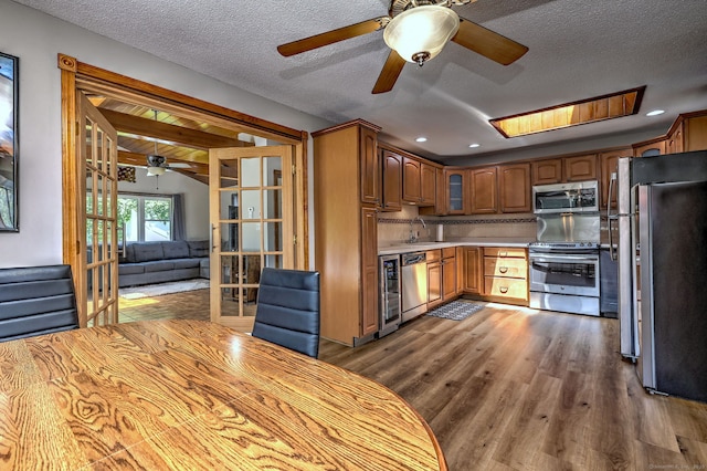 50 Sea Hill Rd, North Branford, CT 06471 - kitchen featuring stainless steel appliances, ceiling fan, a sink, wood finished floors, and light countertops