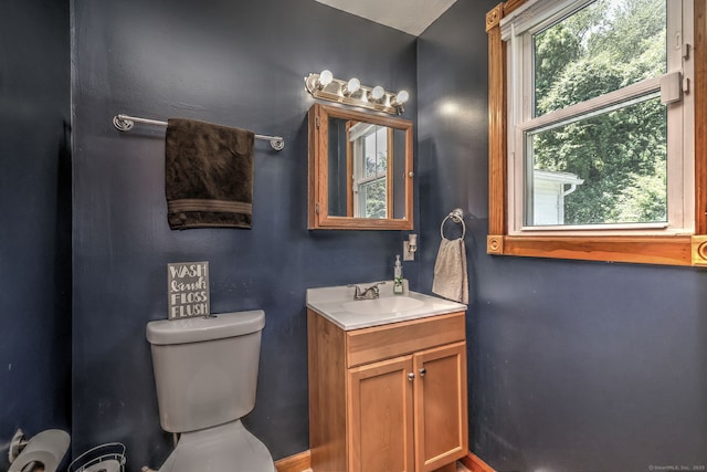 50 Sea Hill Rd, North Branford, CT 06471 - half bathroom featuring vanity, toilet, and baseboards