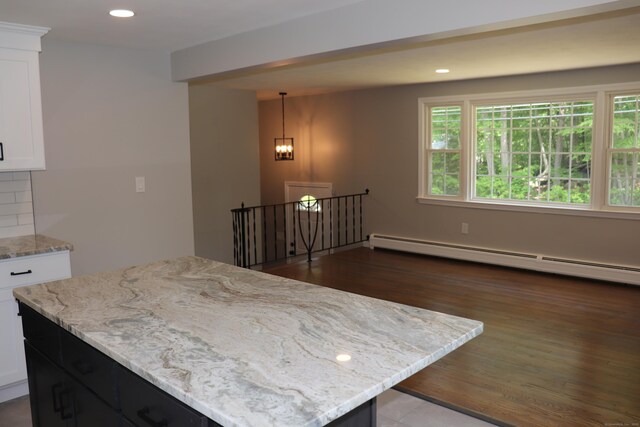 197 New Rd, Tolland, CT 06084 - kitchen with plenty of natural light, white cabinets, a baseboard radiator, recessed lighting, and light stone countertops