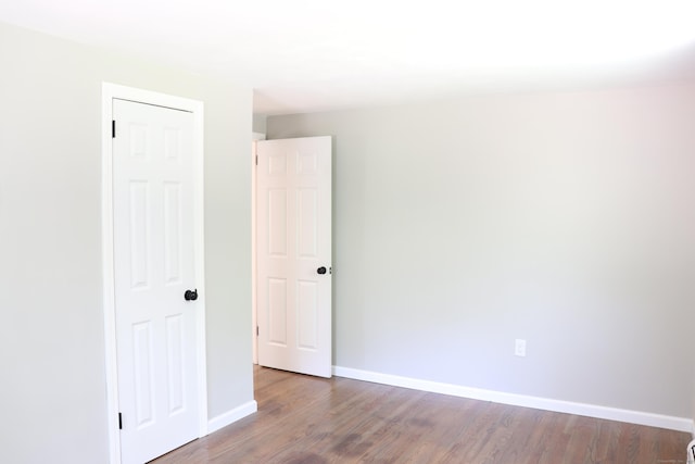 197 New Rd, Tolland, CT 06084 - empty room with wood finished floors and baseboards