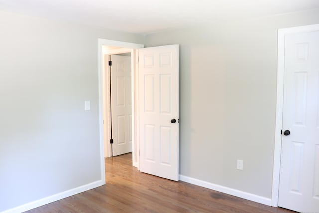 197 New Rd, Tolland, CT 06084 - unfurnished bedroom with baseboards and wood finished floors