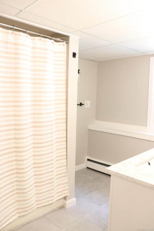 197 New Rd, Tolland, CT 06084 - full bathroom featuring baseboard heating, vanity, tile patterned floors, curtained shower, and baseboards
