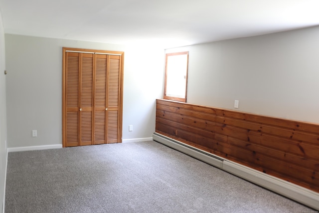 197 New Rd, Tolland, CT 06084 - unfurnished bedroom with a baseboard radiator, a closet, carpet, and baseboards