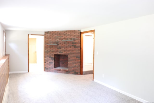 197 New Rd, Tolland, CT 06084 - unfurnished living room featuring carpet floors, a fireplace, and baseboards