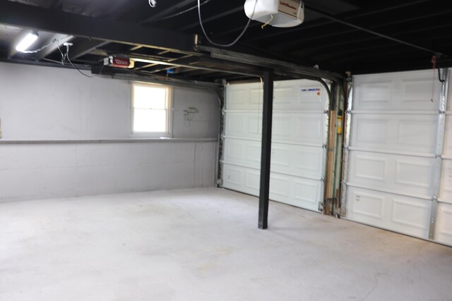 197 New Rd, Tolland, CT 06084 - garage featuring a garage door opener
