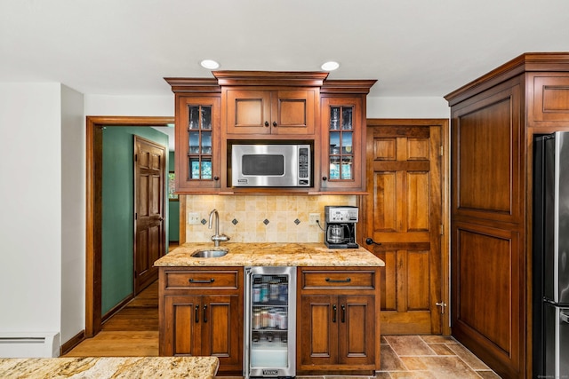 37 Sheffield Ln, Madison, CT 06443 - kitchen with stainless steel microwave, freestanding refrigerator, beverage cooler, tasteful backsplash, and light stone counters