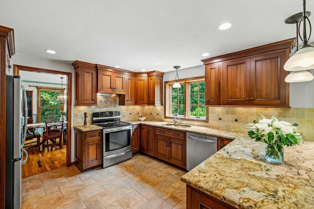 37 Sheffield Ln, Madison, CT 06443 - kitchen with appliances with stainless steel finishes, recessed lighting, light stone countertops, pendant lighting, and decorative backsplash