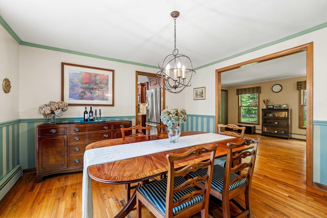 37 Sheffield Ln, Madison, CT 06443 - dining room featuring a baseboard radiator, a wainscoted wall, light wood-style flooring, a chandelier, and ornamental molding