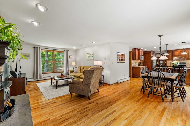 37 Sheffield Ln, Madison, CT 06443 - living room featuring a baseboard heating unit, light wood finished floors, and recessed lighting