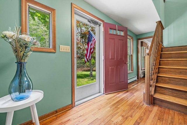 37 Sheffield Ln, Madison, CT 06443 - foyer entrance featuring light wood-style flooring, stairs, and a baseboard heating unit