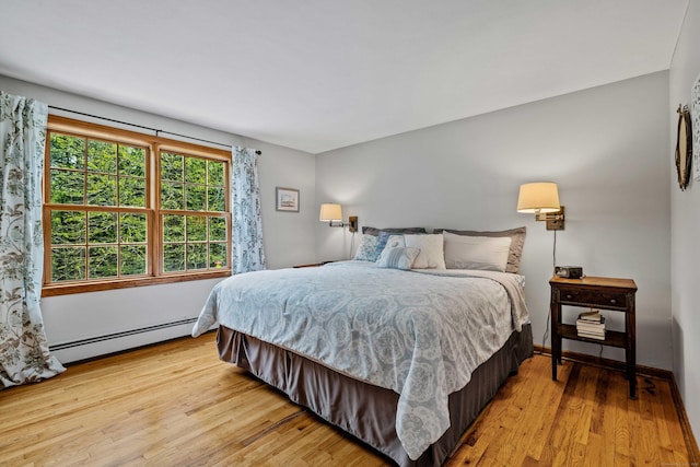 37 Sheffield Ln, Madison, CT 06443 - bedroom featuring a baseboard heating unit and light wood-style floors